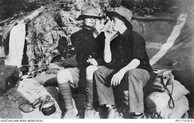 wo Australian soldiers sharing a cigarette at Gallipoli. Identified on the left is 1303 Private George Warrener and on the right 1344 Private Dennis Hehir.